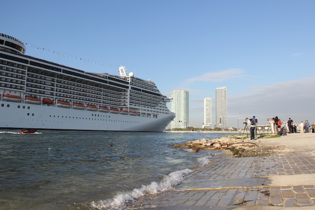 Clumps of photographers snapped away as MSC Divina sailed past before turning around to dock on the bank opposite