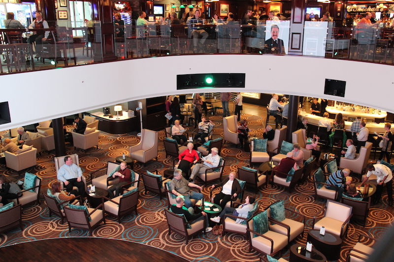 Norwegian Getaway Cruise Ship Atrium where the Guest Services, Excursions Desk, Cyber Cafe, Video wall and Atrium Cafe and Bar are located