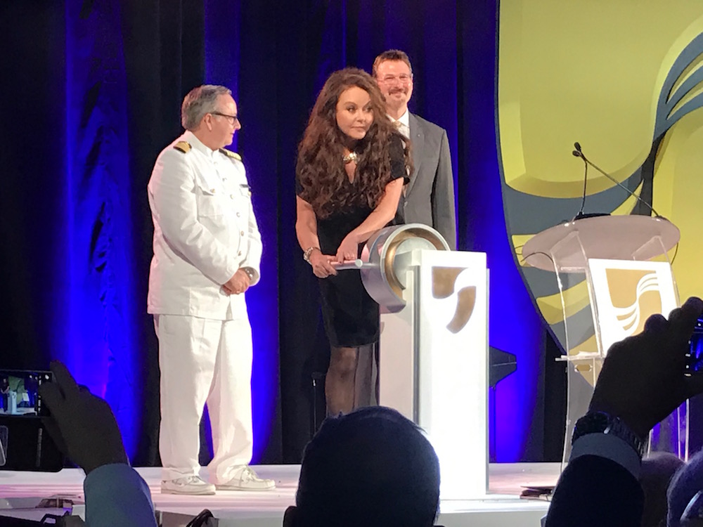 Sarah Brightman launches the champagne bottle at Seabourn Encore naming ceremony